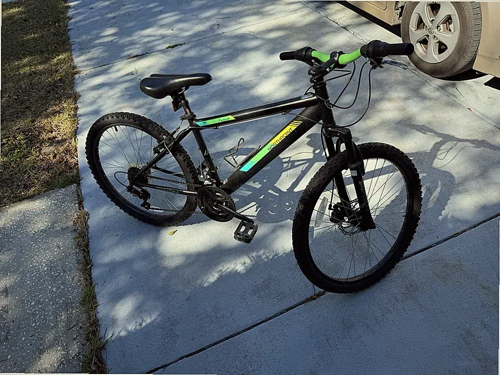 Northrock 24 in Kids Mountain Bike Black Green Disc Brakes Front Suspension